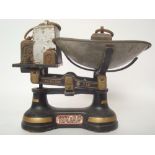 A set of early 20th Century Chayney & Co Ltd cast iron weighing scales with graduated sets of brass