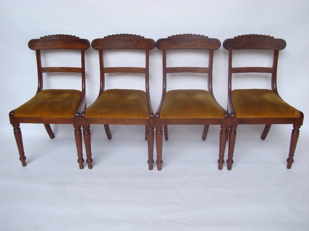 A set of four George IV mahogany dining chairs,