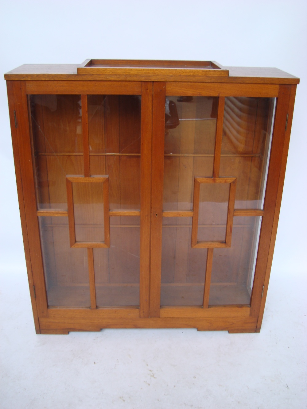 An Art Deco Indian teak glazed display cabinet.