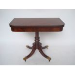 A George IV mahogany and rosewood banded pedestal tea table,