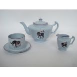 An Arcadian blue china three piece tea service, each piece decorated with a good luck black cat.