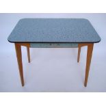 A 1950's blue and black design formica topped kitchen table.