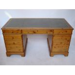 A large pine twin pedestal desk,