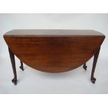 Early George III mahogany oval dropleaf table, with swing action,