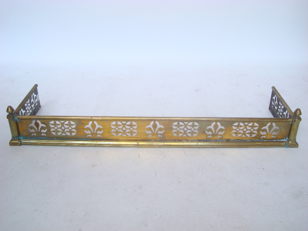 A Victorian pierced brass fender.