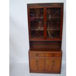 A George III style reproduction mahogany side cabinet, the upper section with astragal glazed doors,