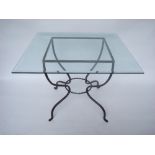 A modern square glass topped table on polished steel base.
100 x 100 x 74cm high.