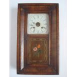A late 19th Century American walnut wall clock, with eight day striking Ansonia movement.