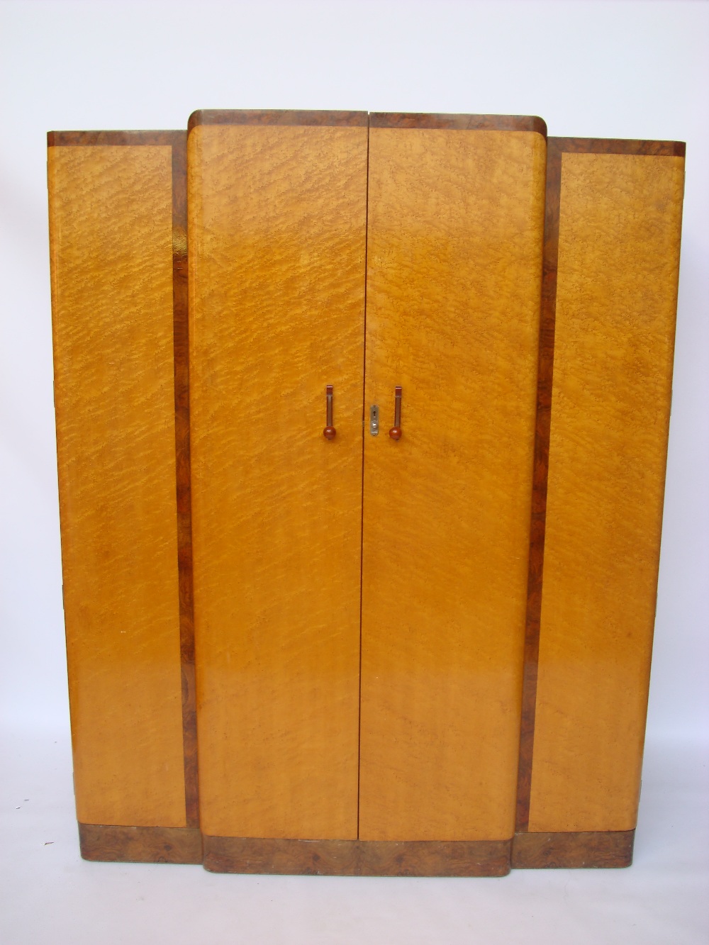 An Art Deco Birds eye maple and burr walnut crossbanded breakfront wardrobe,