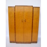 An Art Deco Birds eye maple and burr walnut crossbanded breakfront wardrobe,