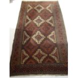 An early 20th Century Belouch, brown ground rug.
208 x 111cm.