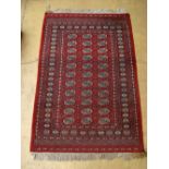 A red ground Pakistani Bokhara rug. 
204 x 128cm.