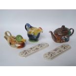 Three Tony Wood novelty teapots and two ceramic door plates.