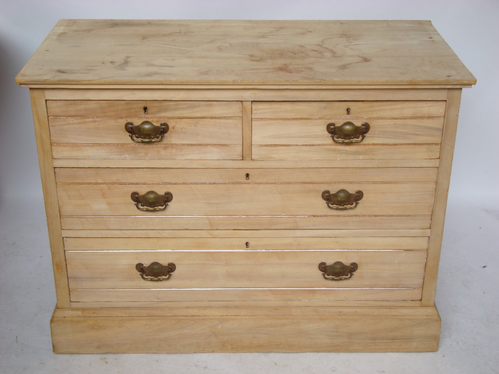 An Edwardian pine bleached satinwood chest of drawers,