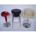 A cream faux leather bar stool, on chrome base, a faux leather and chrome stool and another (3).