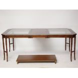 A reproduction mahogany extending dining table,