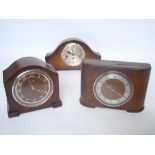 A 1930's oak cased Smiths quarter striking 8 day mantel clock,