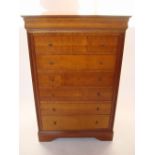 A French Grange furniture cherry wood tall chest of drawers.