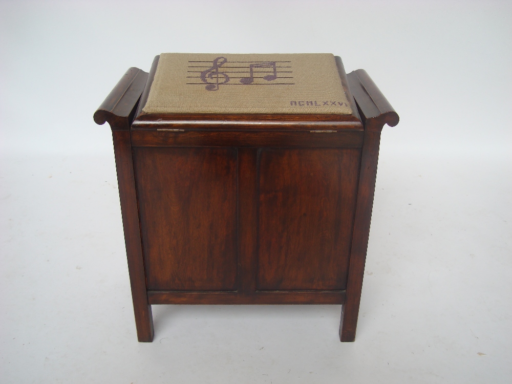 Early 20th Century walnut box piano stool with hinged tapestry covered seat.