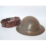 A WWI Royal Artillery tin helmet and 'The Stohwinter' leather bandolier (2).