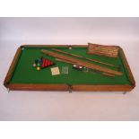 An Edwardian quarter size oak table top snooker / billiards table with slate bed,