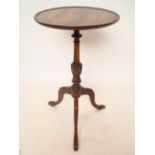 A reproduction George III style mahogany tripod table.