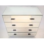 A contemporary mirrored chest of four long drawers, on plinth base.