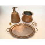 An Indian large copper ewer, with an Indian large hammered copper vessel,
