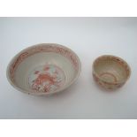 A Chinese Ming Swatow bowl, greyish glazed crackle ground decorated in red,