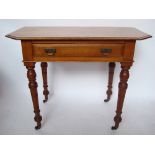 A late Victorian James Shoolbred & Co walnut writing table,