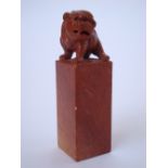 A Chinese red soapstone seal, carved with dog of Fo finial.