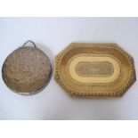 A 19th Century Indian pierced brass tray with chased and embossed decoration and a copper dinner