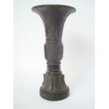 A Chinese bronze Gu vase of archaic form, poss Ming, six character Xuande mark, restoration to stem,