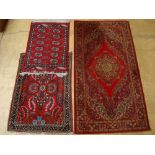 A Hamadan rug, a Pakistani Bokhara rug and a Persian design machine woven Wilton carpet (3).