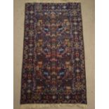 A Belouch rug, blue ground.
113 x 204cm.