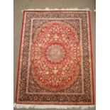 A Kashan style red ground carpet. 
190 x 140cm.