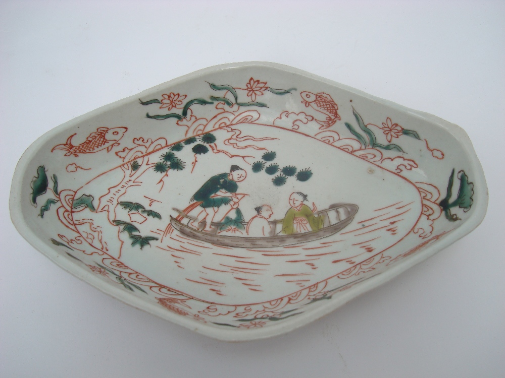 An 18th Century Chinese lozenge shaped dish, decorated in red,