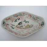 An 18th Century Chinese lozenge shaped dish, decorated in red,