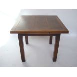 A 1930's oak extending draw leaf table.