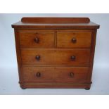 A Victorian mahogany chest of drawers, with two short and two graduated long drawers,