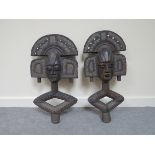 A pair of African funeral masks.  64cm long