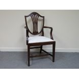 An early to mid 20th Century mahogany carved chair with wheatear back