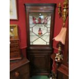 A George III Revival mahogany astragal glazed two tier corner cabinet on bracket feet (with key)