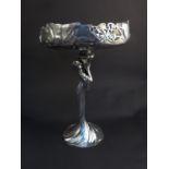 A circa 1900 Art Nouveau silvered pewter centrepiece, the pierced vine and leaf bowl held aloft by