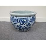 A 19th Century blue and white fish bowl decorated with blossom, butterflies and birds, multiple