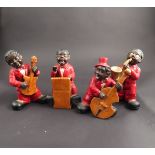 Four ceramic jazz band figures