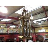 A brassed ceiling lantern with bevelled glass panels