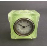 An early 20th Century pressed green glass timepiece, Arabic numerated dial