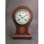 An Edwardian mahogany and inlaid balloon form mantel clock, Roman numerated dial, 8-day movement