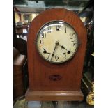 An American oak domed mantel clock, Arabic numerated dial, 8-day movement